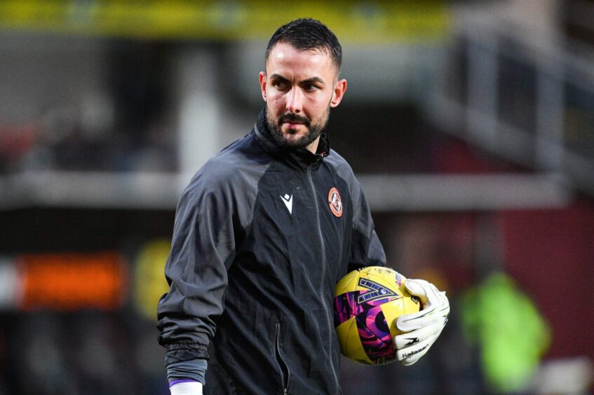Mark Birighitti warming up with Dundee United