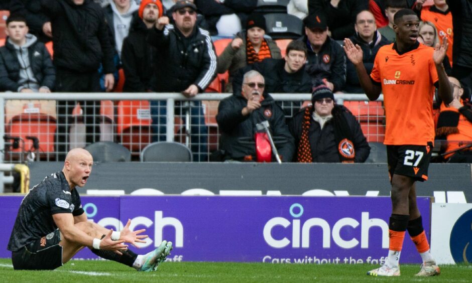 Dundee United defender Loick Ayina was punished with a penalty after his challenge on Curtis Main