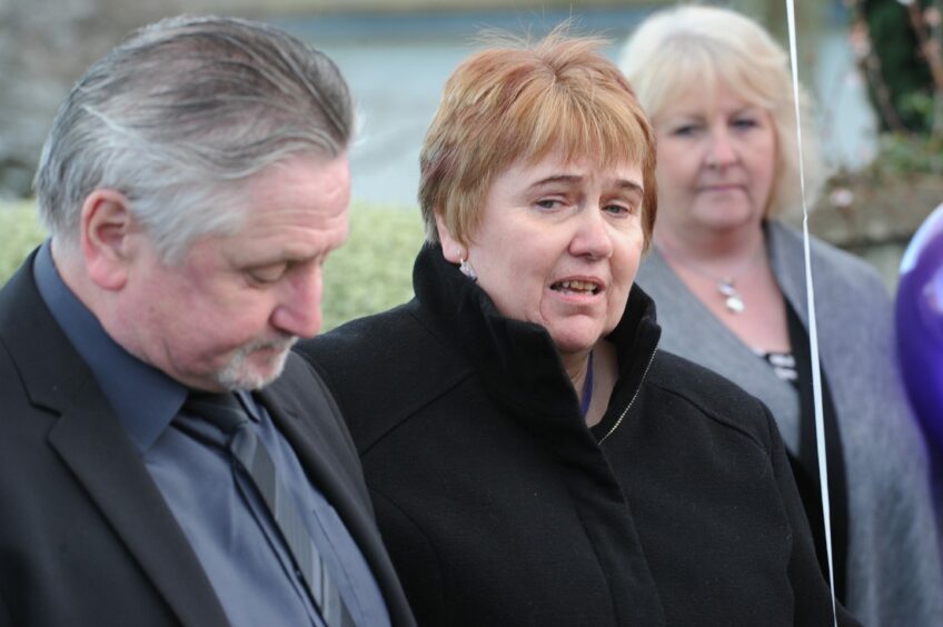 Allison Dewar speaking at a memorial event in 2015.