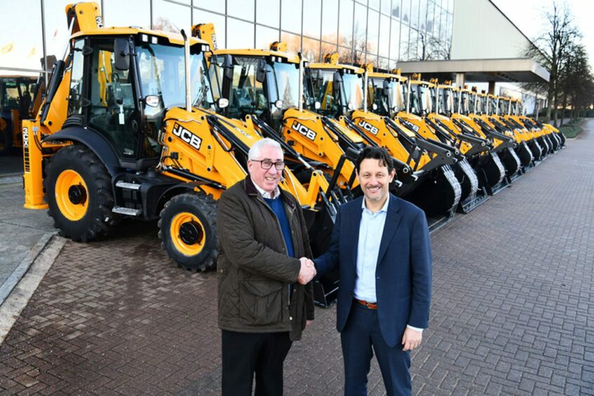 Morris Leslie and JCB Sales managing director Marco Bersellini after the Perthshire firm's recent £87.5m order