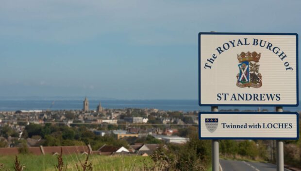 Name sign with town of St Andrews in the background.