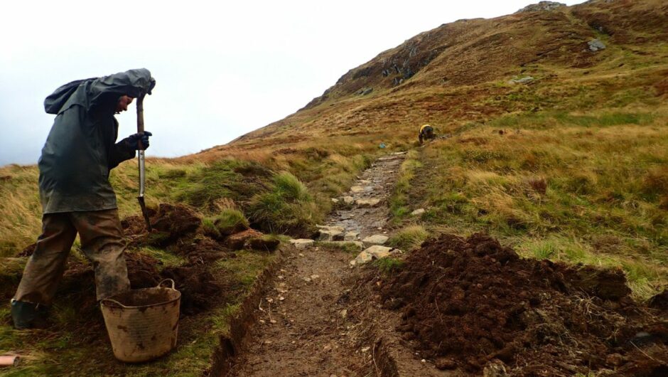 person with a spade doing path maintenance on Ben Lomond.