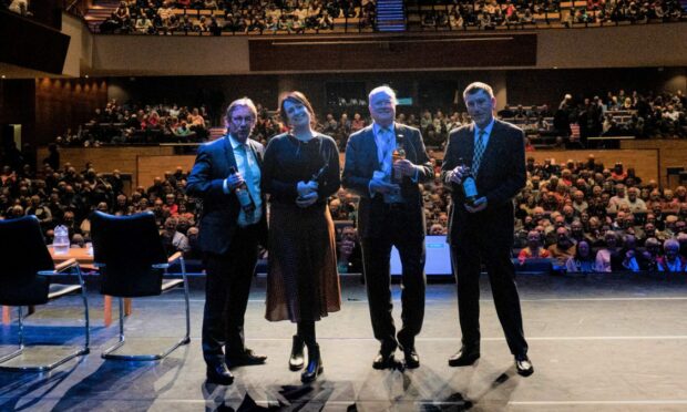 Endurance 22 team (left to right), Nico Vincent, Natalie Hewit, Donald Lamont & John Shears at the end of their talk in Perth Concert Hall. They were presented with Shackleton whisky by Mike Robinson. Image: RSGS