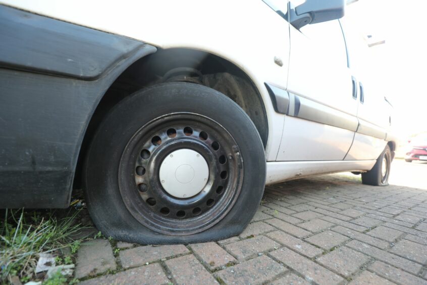 A flat tyre on the van.