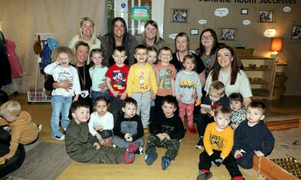 Staff with youngsters at Woodlea Children's Centre in Dundee. Image: Gareth Jennings/DC Thomson