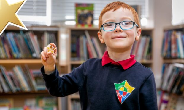 Glenrothes youngster Taylor Dryburgh with his Courier Gold Star award. Image: Steve Brown/DC Thomson.