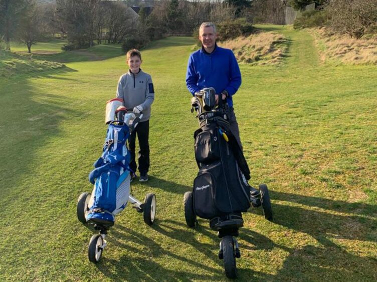 Alan and Ethan on the course