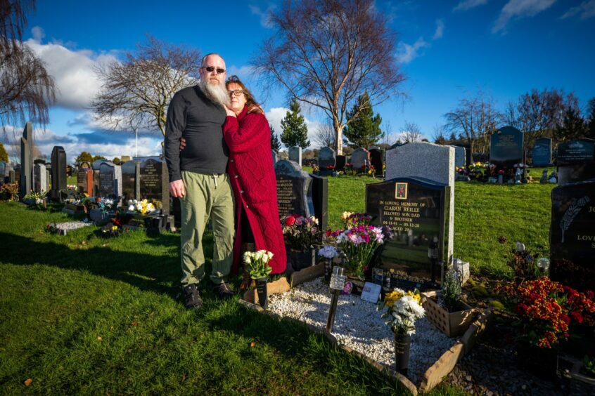 David and Louise, pictured at the cememtery, were heatbroken by the deaths of Ciaran and Siobhan. Image: Kim Cessford/DC Thomson