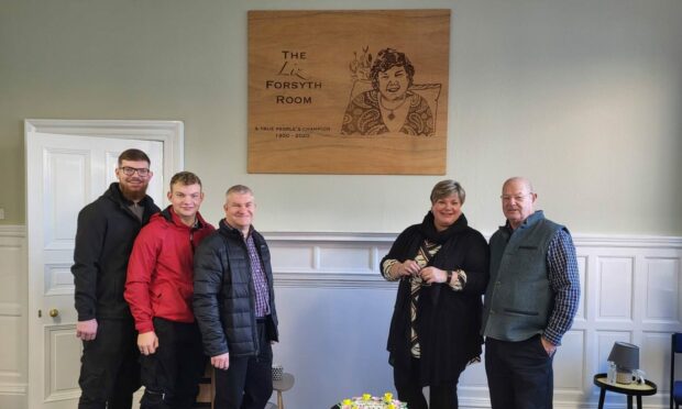 Liz's grandsons Matt and Adam Wood, son-in-law Grahame Wood, daughter Suzie Wood and husband Brian Forsyth at the Voluntary Action Angus ceremony.