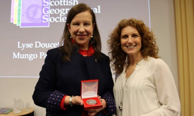 Lyse Doucet (left) and Vanessa Collingridge with the Mungo Park Medal in Perth. Image: RSGS
