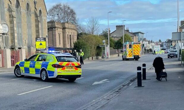 Police at the scene of the collision on Queen Street in Broughty Ferry. Image: Ben MacDonald/DC Thomson