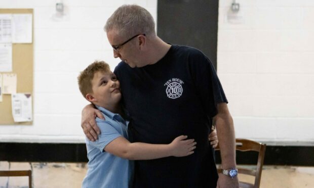 Harris is from Kirriemuir and has just turned 10. He's pictured here with David Dunlop at Dundee Rep, in rehearsal for Old Boy.