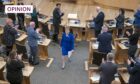 Outgoing First Minister Nicola Sturgeon leaves the main chamber after her last First Minster's Questions. Image: PA