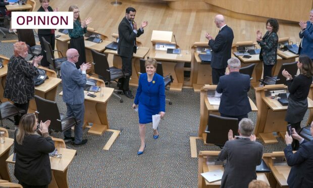 Outgoing First Minister Nicola Sturgeon leaves the main chamber after her last First Minster's Questions. Image: PA