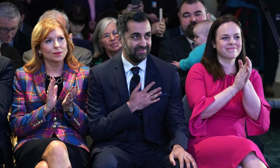 Ash Regan, Humza Yousaf and Kate Forbes react to the announcement that he has won the SNP leadership race.
