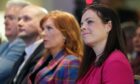 Kate Forbes (right) listens to Humza Yousaf speaking at Murrayfield Stadium in Edinburgh, after it was announced that he is the new Scottish National Party leader. Image: Andrew Milligan/PA.