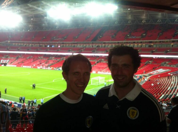 Ross Cunningham and a friend in Scotland football tops at Wembley stadium.