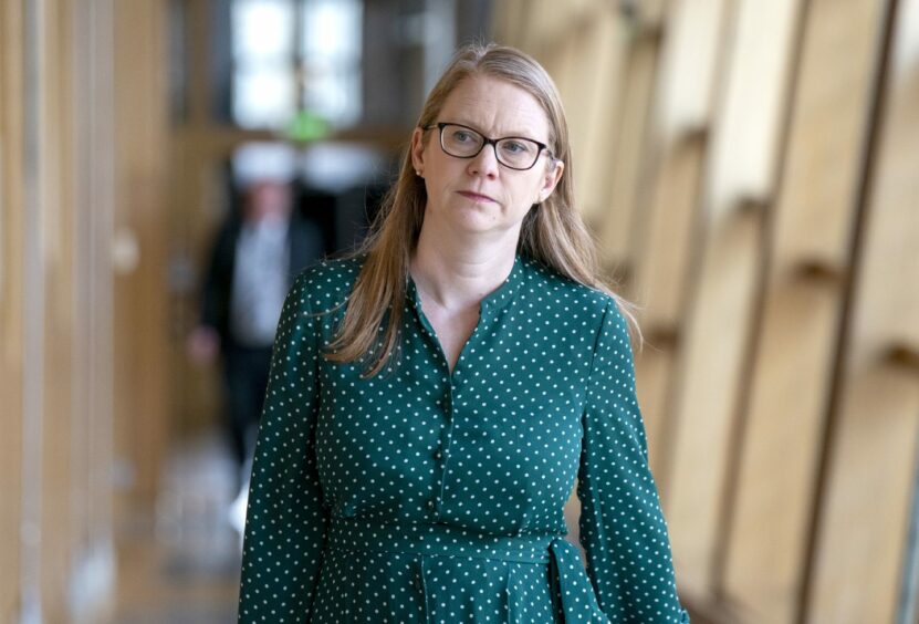 Dunfermline SNP MSP Shirley-Anne Somerville walks down a corridor at Holyrood