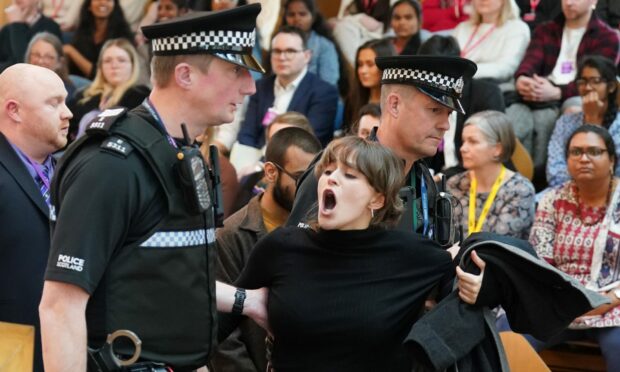 Anti-oil protesters brought FMQs to a halt. Image: PA.