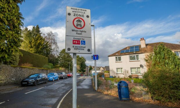 Signs - like this one at Inch View Primary School, in Perth - tell motorists when driving is banned. Image: Steve MacDougall/DC Thomson.