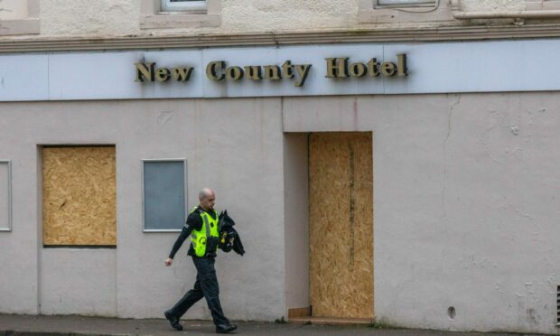 Police met guests at the New County Hotel on Wednesday. Image: Steve MacDougall/DC Thomson