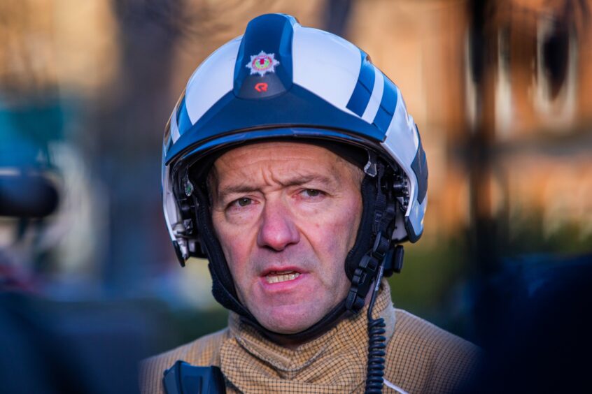 Jason Sharp in firefighter helmet