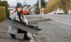 Kelly McGregor with debris from the hit-and-run. Image: Steve Brown/DC Thomson