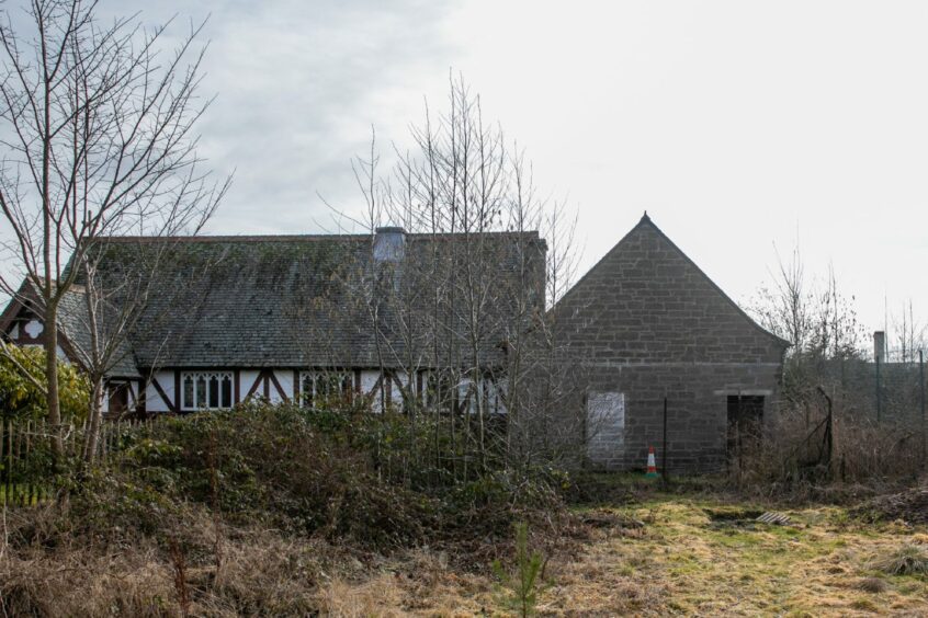 Scrubland behind Stanley church and adjoining derelict hall