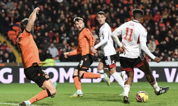 Duk backheels Aberdeen in front after robbing Ryan Edwards of possession. Image: SNS