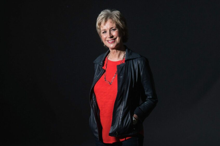 Scottish presenter Sally Magnusson standing against a backdrop. She will be a keynote speaker at Perth's Soutar Festival 2023.