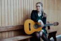 A Kilgraston pupil with a guitar. Kilgraston is one of the best Perth and Kinross schools.