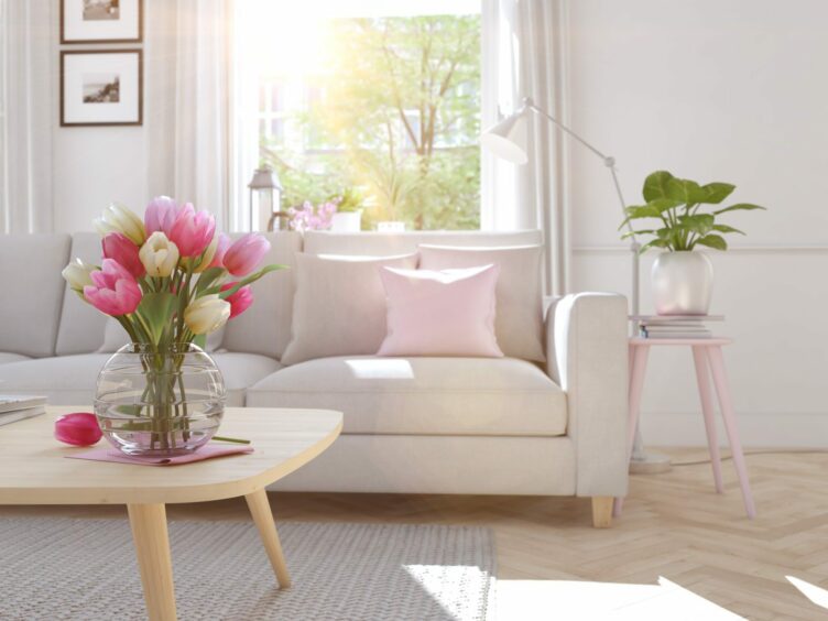 A living room in springtime with flowers. There are just so many spring decoration ideas out there!