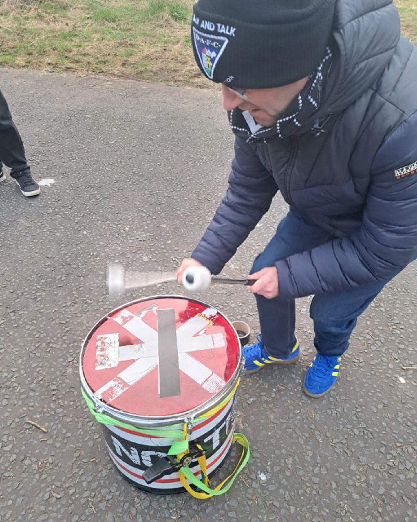 Mental health officer for the Pars Foundation Eddie Martin banging a Dunfermline drum.