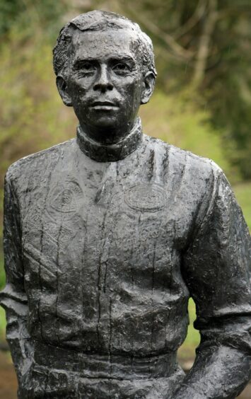 The statue at Kilmany, Fife, of Formula One World champion Jim Clark, by David Annand.