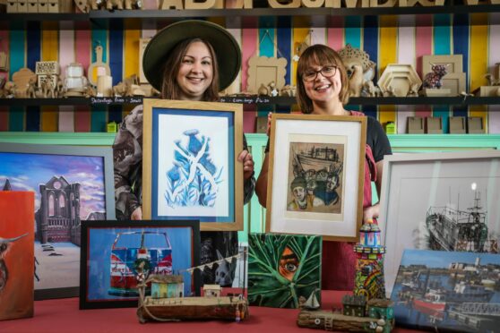 Freelance Artist Rachel Manzie (left) and Art Attack Angus owner Lauren Munro at the Arbroath studio with pieces from the upcoming exhibition. Image: Mhairi Edwards/DC Thomson