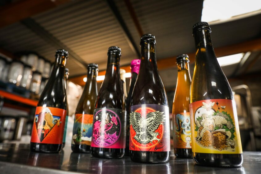 Colourful beer labels featuring an eagle, a mountain and a dragon by artist Jimbob Isaac.