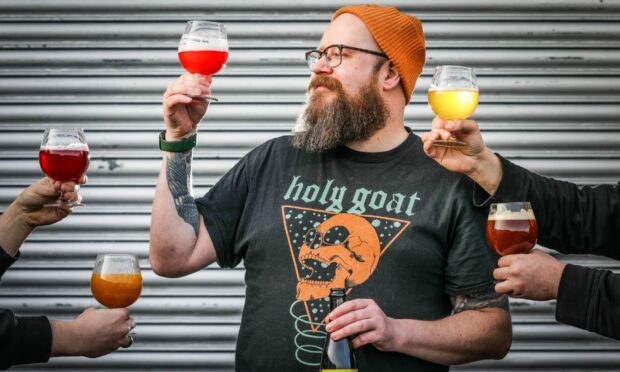 Holy Goat Brewing co-founder James Scanlan and a range of colourful beers. Image: Mhairi Edwards/DC Thomson