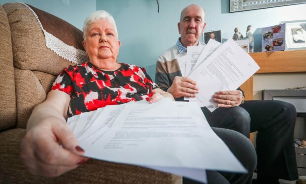 Pat and Stuart Brown, residents of Naughton Place, with their energy bills.
