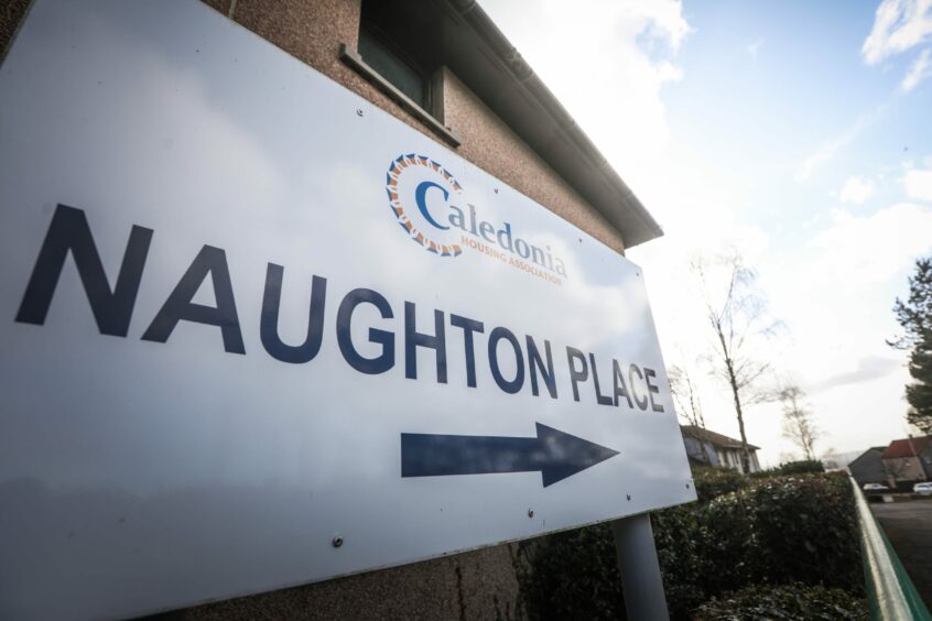 A sign for Naughton Place in Dundee