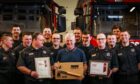 Roy King and Forfar crew members at the retiral event in Forfar's Strang Street fire station. Image: Mhairi Edwards/DC Thomson