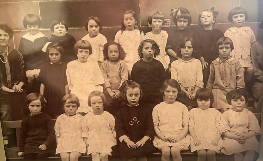 Back in her early years in Maryhill, Glasgow, Sadie is shown back row, far right.