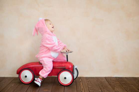 Little kid dressed as bunny for the listicle about Easter activities for family