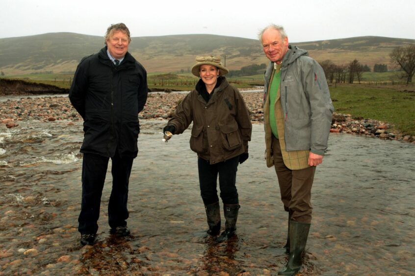 Broadcaster and keen angler Fiona Armstrong toasts the Rottal project with Tom Samson and Dr Marshall Halliday of Esk Fisheries Trust a decade ago. 