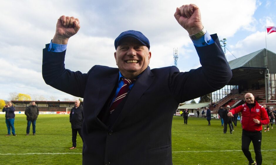 Dick Campbell raises his arms aloft in celebration during his time as Arbroath manager.