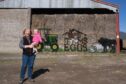 Alison Stodart and 18-month-old granddaughter Sophie with 'Balesy' Fleur's latest creation for the Mill of Inverarity farm shop. Image: Paul Reid