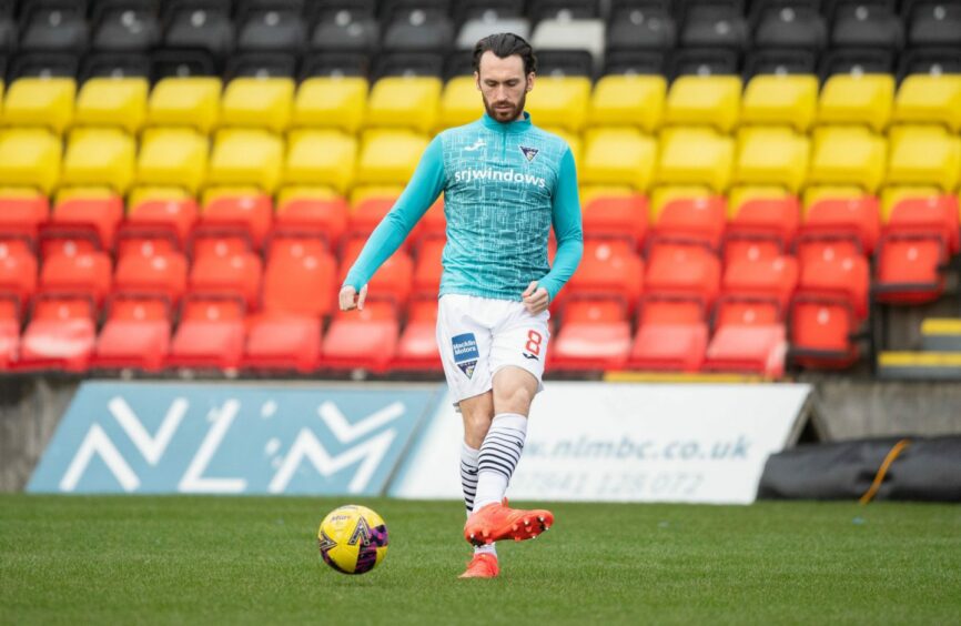 Dunfermline Athletic midfielder Joe Chalmers warms up before the Scottish Cup tie against Partick Thistle in January 2023, in Glasgow, Scotland. Image: Paul Devlin / SNS Group.