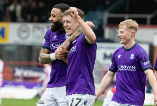 Luke McCowan celebrates his goal as Dundee go 3-0 up. Image: Craig Brown/SNS.