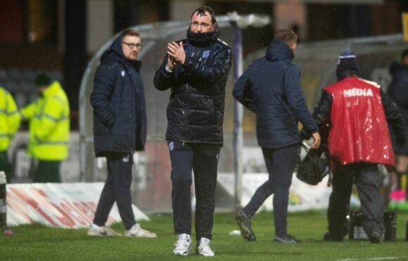 Gary Bowyer applauds the Dens Park crowd after his side beat Raith Rovers. Image: SNS.