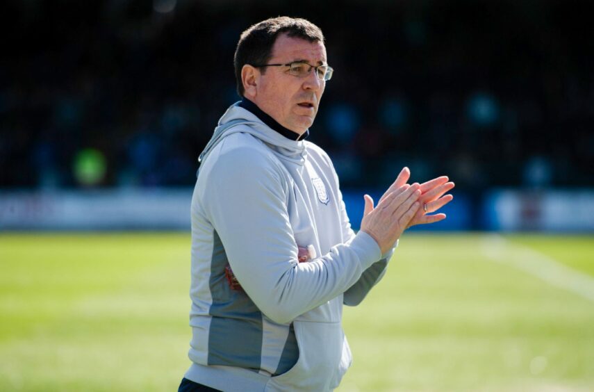 Dundee manager Gary Bowyer applauds fans at Dens Park. Image: SNS