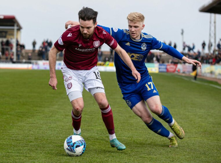 Ryan Dow, left, in action against Cove Rangers for Arbroath